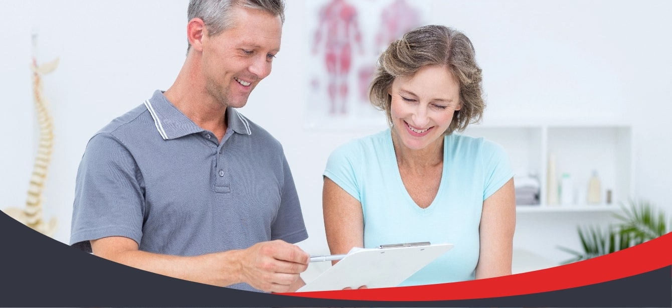 A man and women reviewing a medical chart.